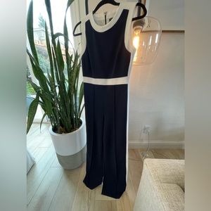 One piece jumpsuit in a stretchy lightweight knit fabric by Tommy Hilfiger.